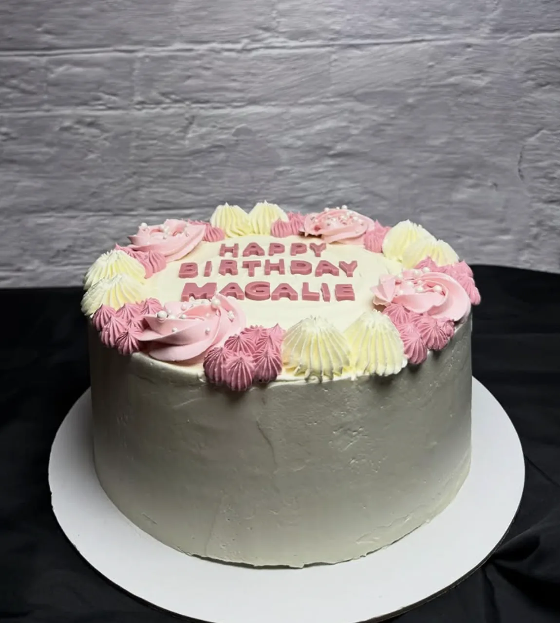 Pink and ivory birthday cake