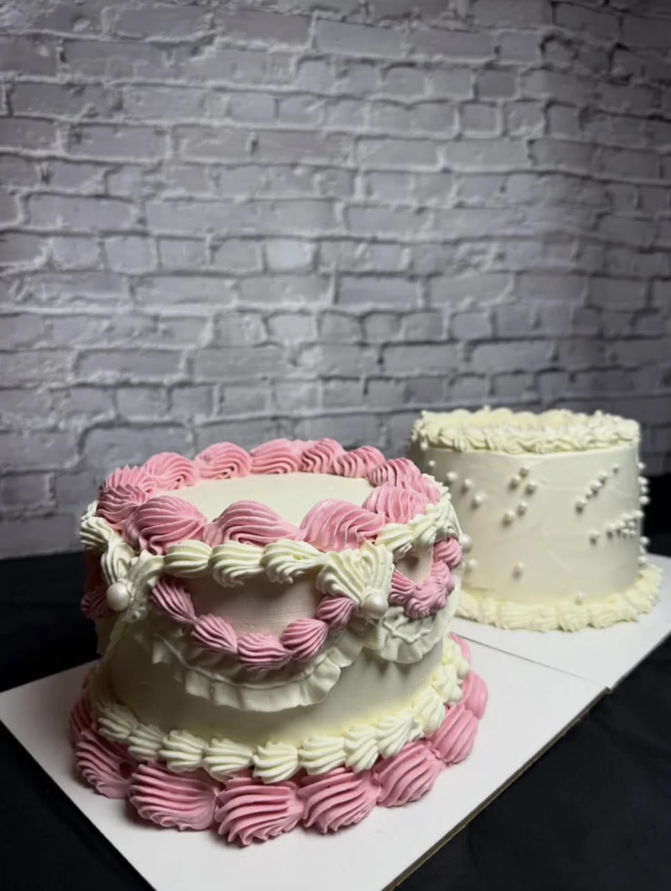 Vintage piped pink and ivory cakes